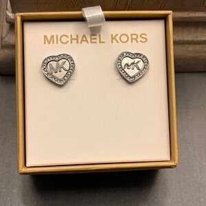 Michael Kors heart-shaped stud earrings in a silver-tone finish.
